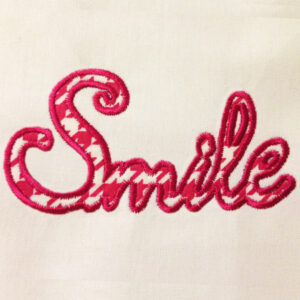 The word “smile” machine embroidery design and appliqué designs in several sizes and styles