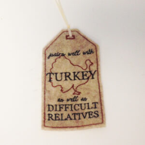 In-the-hoop tag for your Thanksgiving wine bottle – “Pairs well with Turkey as well as Difficult Relatives.”  2 Sizes